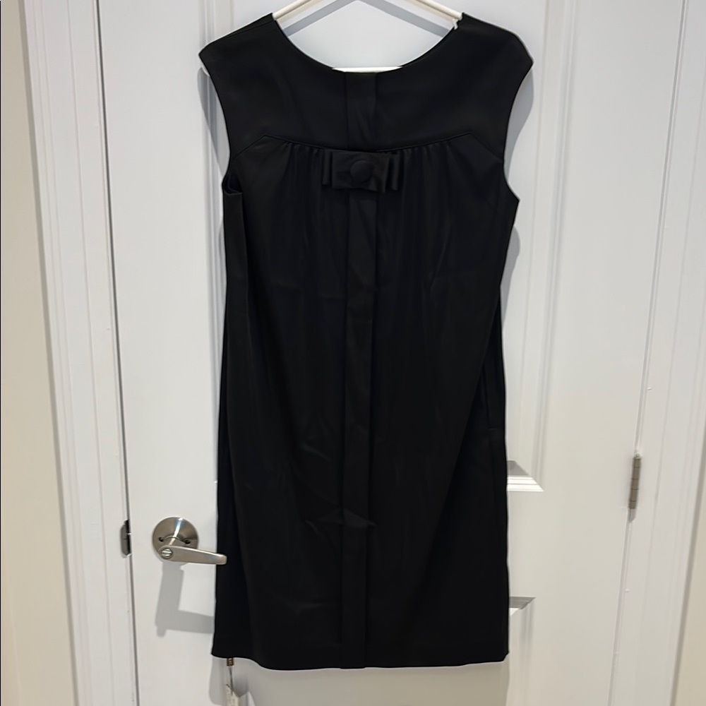 Black dress with bow in front, side pockets